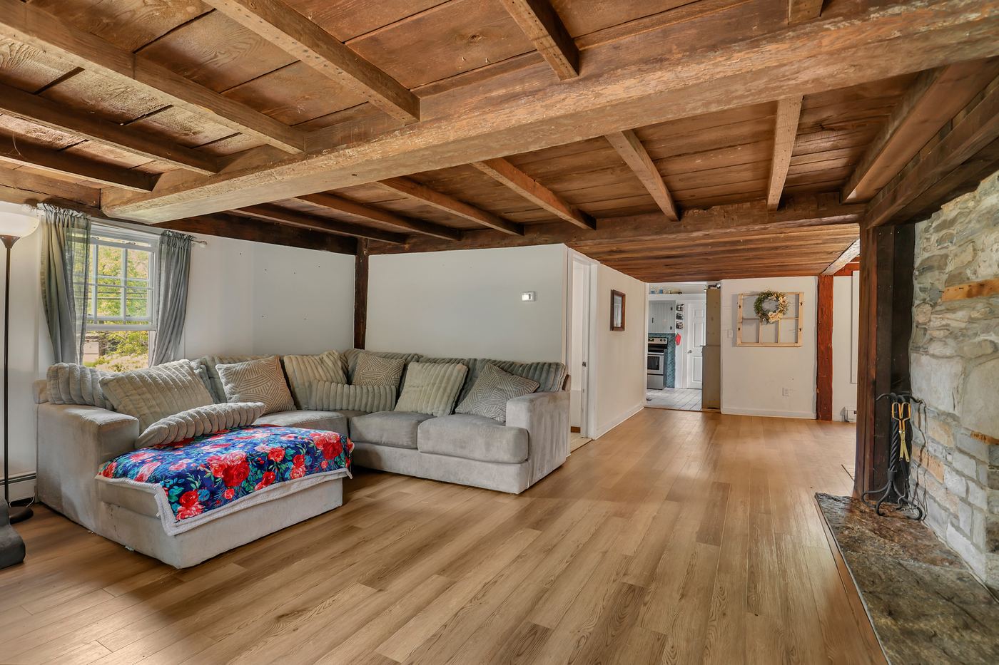 Living room seating area with exposed beams